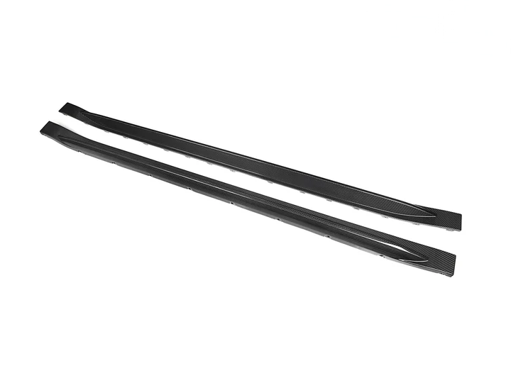 A pair of black dry carbon fiber side skirts designed for the G80 M3 model.