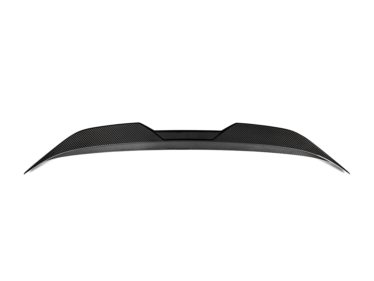 A black AutoTecknic dry carbon fiber performance trunk spoiler for the G87 M2.