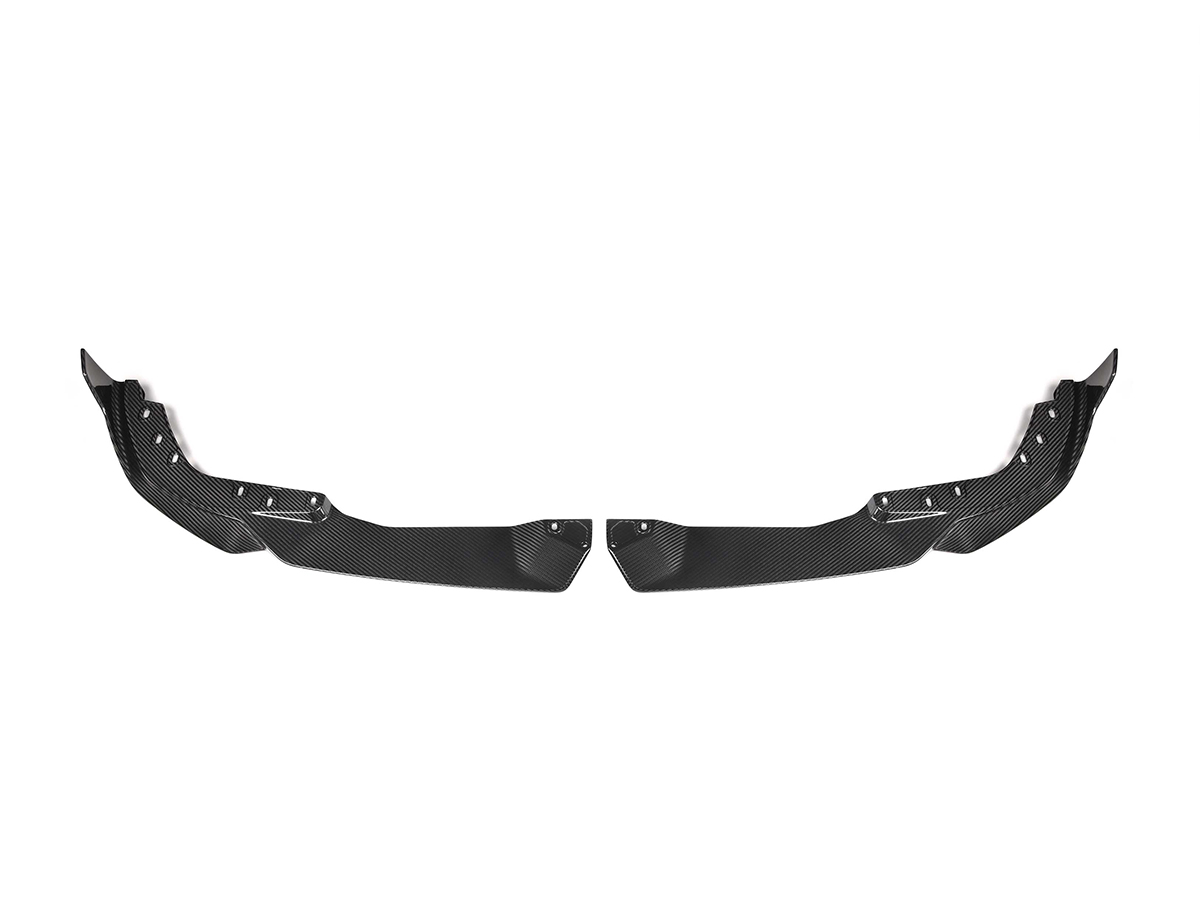 A set of two black carbon fiber front aero splitters for a BMW G20 3-Series M-Sport LCI.