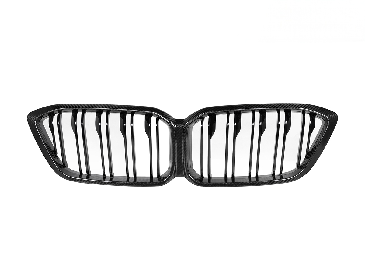 A sleek high gloss black dual center slat dry carbon front grille for an F87 M2 Competition, with a space for the BMW M2 Competition badge.