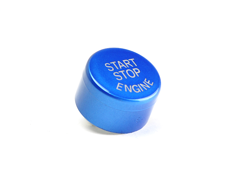 A royal blue start stop button with the text 'START STOP ENGINE' on it, isolated on a white background.