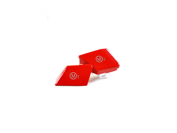 A pair of gloss bright red M1/M2 button set designed for BMW M vehicles, made of ABS plastic with a UV and scratch-resistant clear coat.