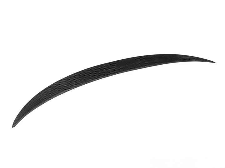A black carbon fiber trunk spoiler for the BMW M3 G80.