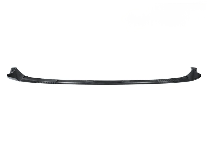 A black AutoTecknic dry carbon fiber performante front aero lip for G80 M3 and G82/ G83 M4.