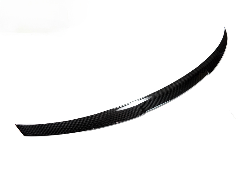 A glossy finish carbon fiber trunk spoiler for the BMW M4 F82.
