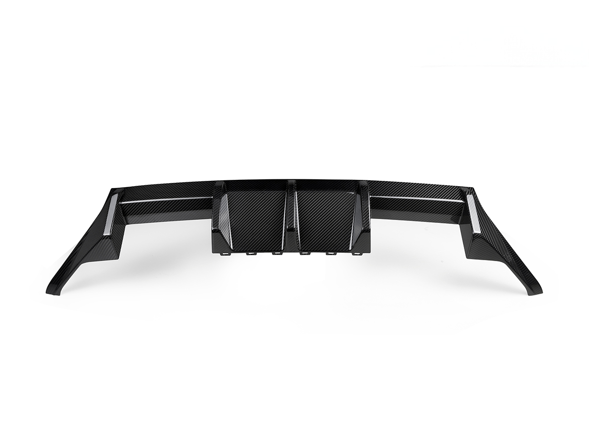 A black AutoTecknic Dry Carbon Performante Rear Diffuser designed for the BMW G87 M2.