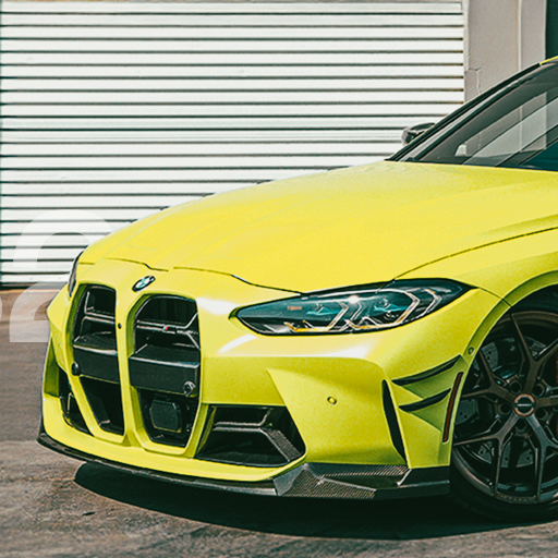 Lime green BMW car parked in front of a white garage door.